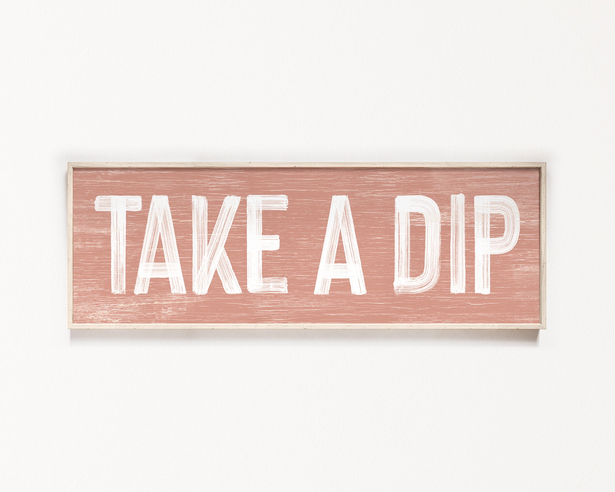 a wooden sign that says take a dip