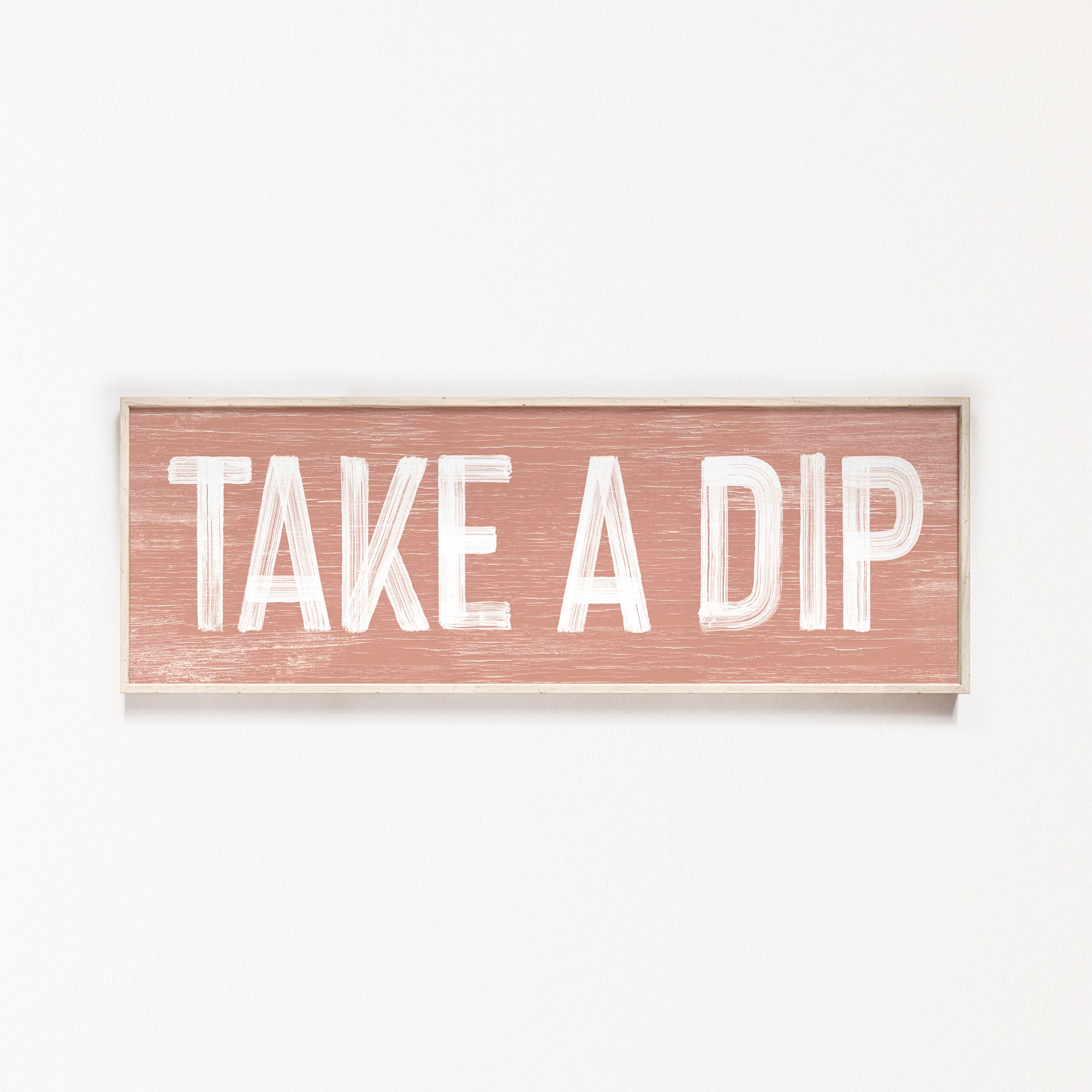 a wooden sign that says take a dip