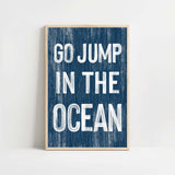 a blue and white poster with the words go jump in the ocean