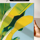 The image is a vibrant abstract painting featuring a large yellow leaf with green and yellow accents, set against a blue background.
