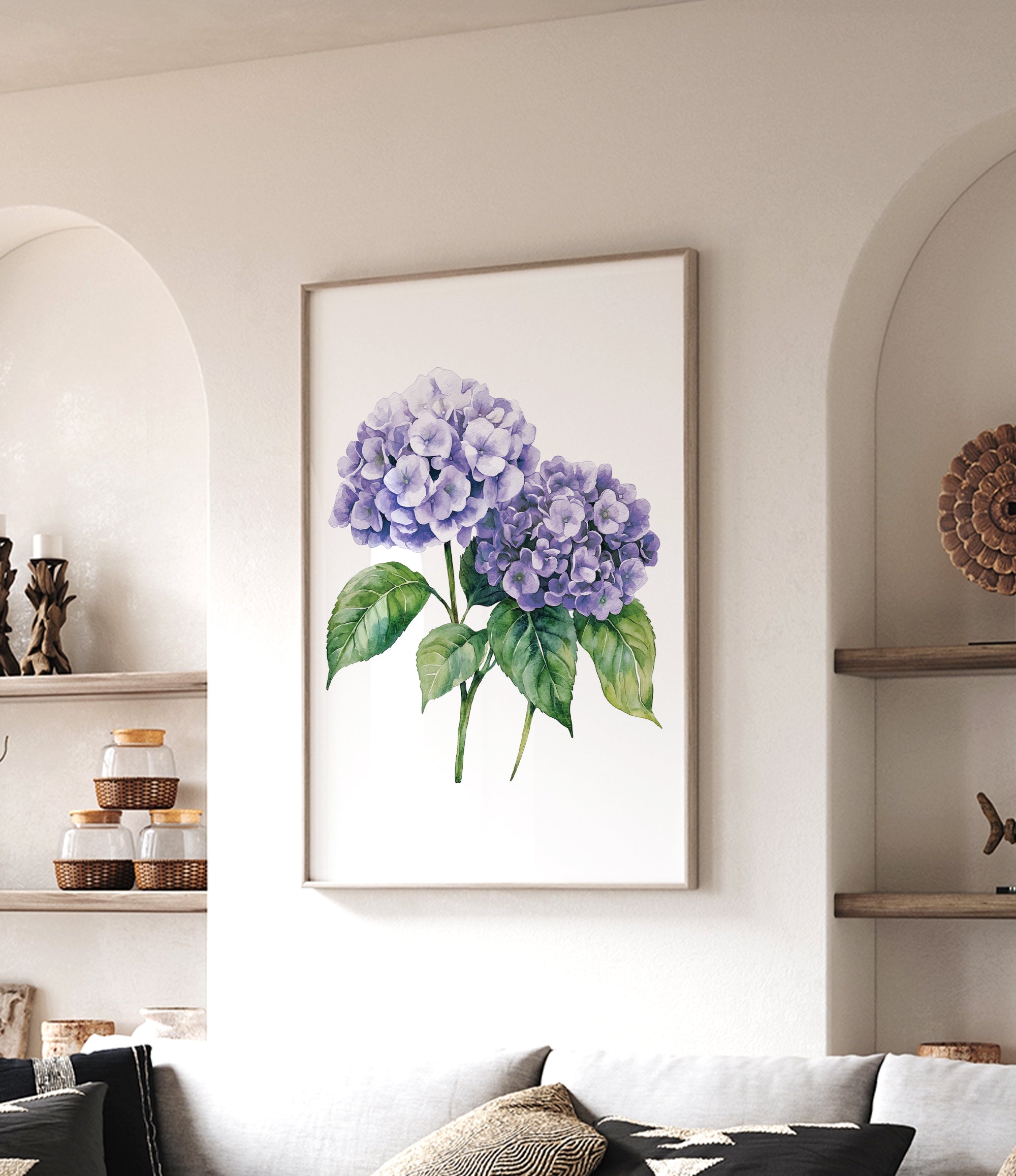 a framed watercolor painting of purple hydrangeas hanging on a wall in a living room.