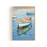 a serene scene of three small boats floating on a calm body of water, with a wooden frame surrounding the artwork.