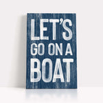 a wooden sign that says let&#39;s go on a boat