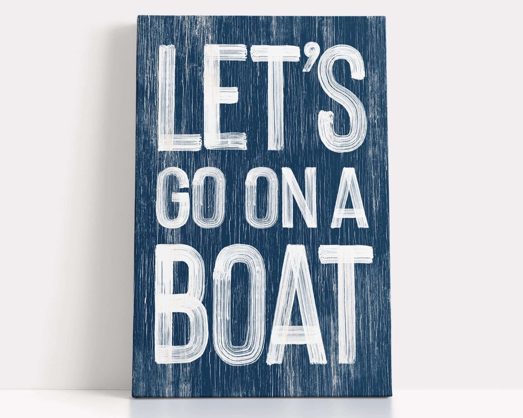 a wooden sign that says let's go on a boat