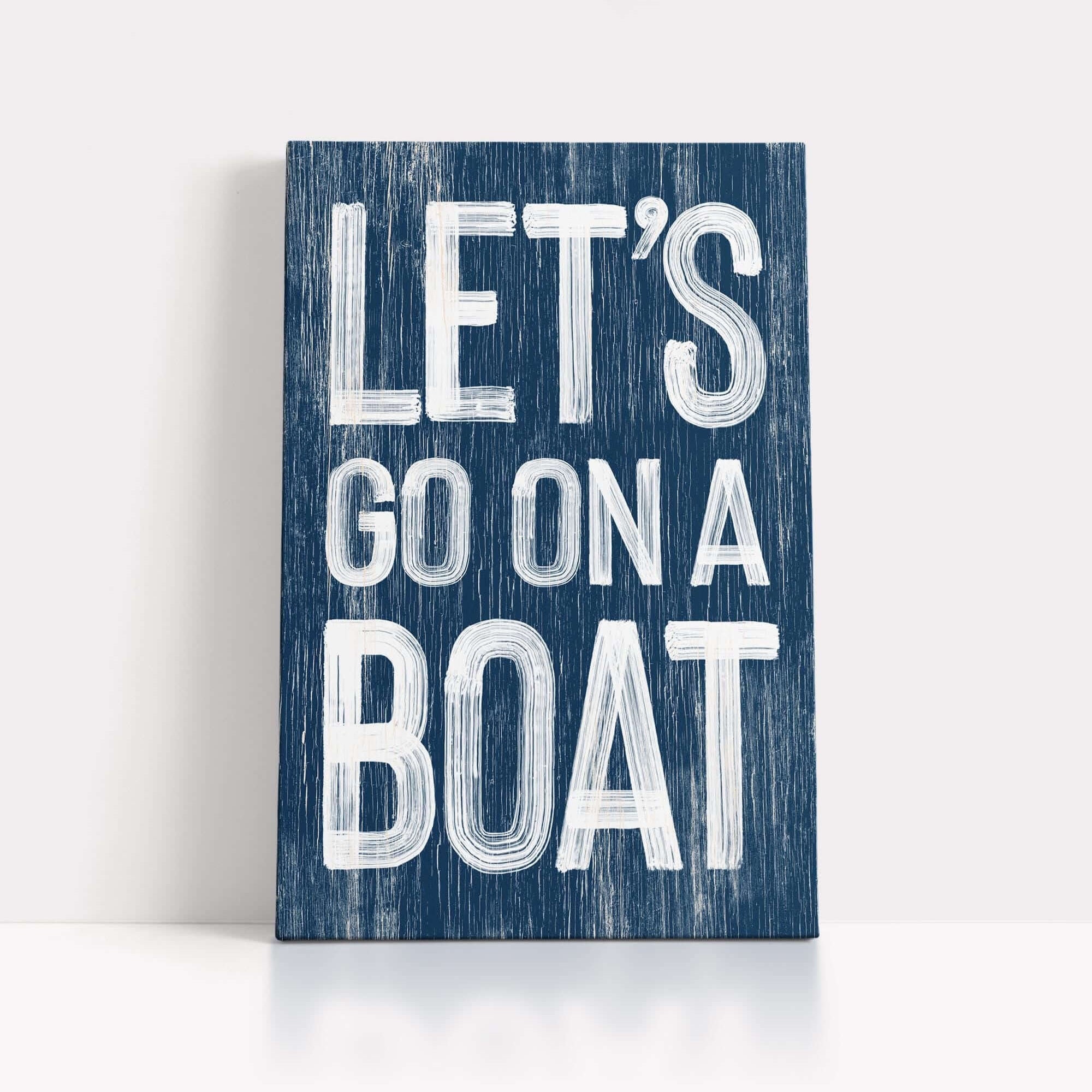 a wooden sign that says let's go on a boat