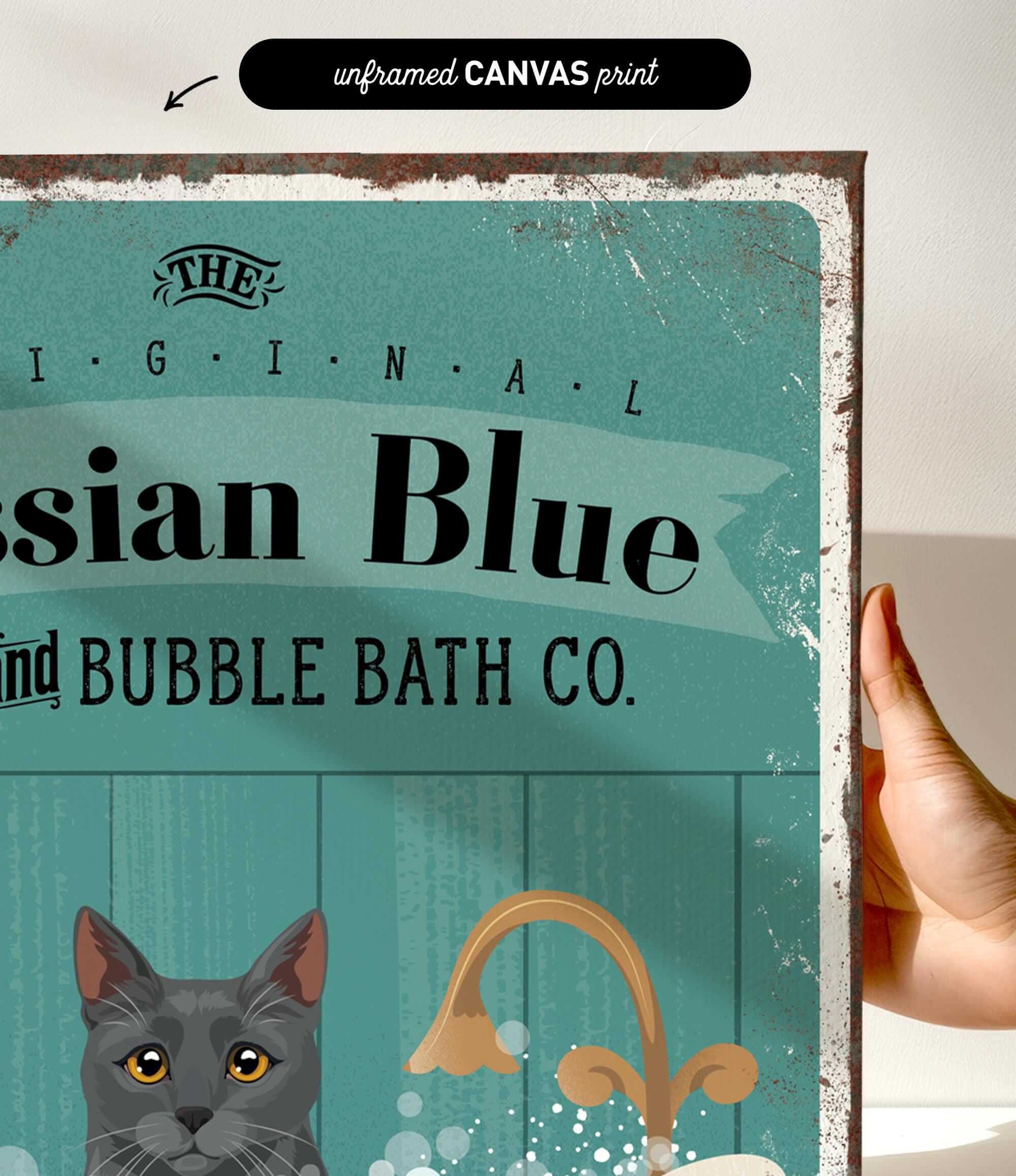 a hand holding a framed print with a vintage-style design.