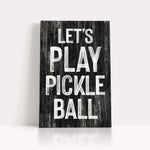 a wooden sign that says let's play pickle ball