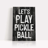 a wooden sign that says let's play pickle ball