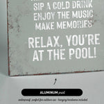 a sign that reads relax you&#39;re at the pool