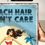 The image is a vintage-style canvas print featuring a woman with long hair and a beach scene with palm trees.