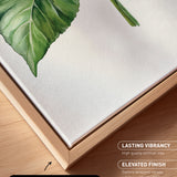 a close-up view of a canvas print with a natural frame, showcasing a detailed view of a green leaf and a stem.
