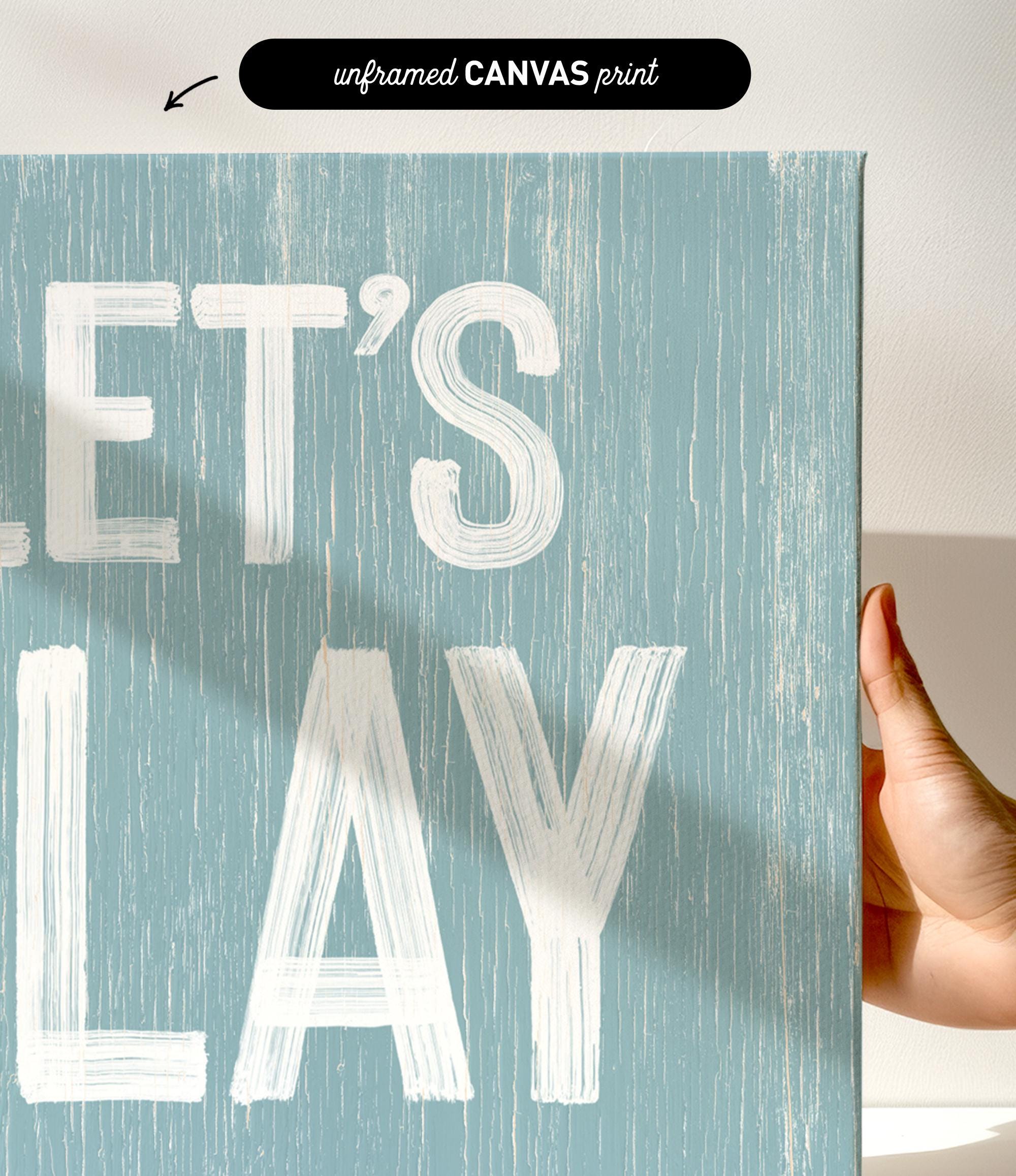 a hand holding a sign that says let&#39;s play