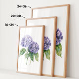 three framed prints of a watercolor painting of purple hydrangeas, each with a different size and frame.