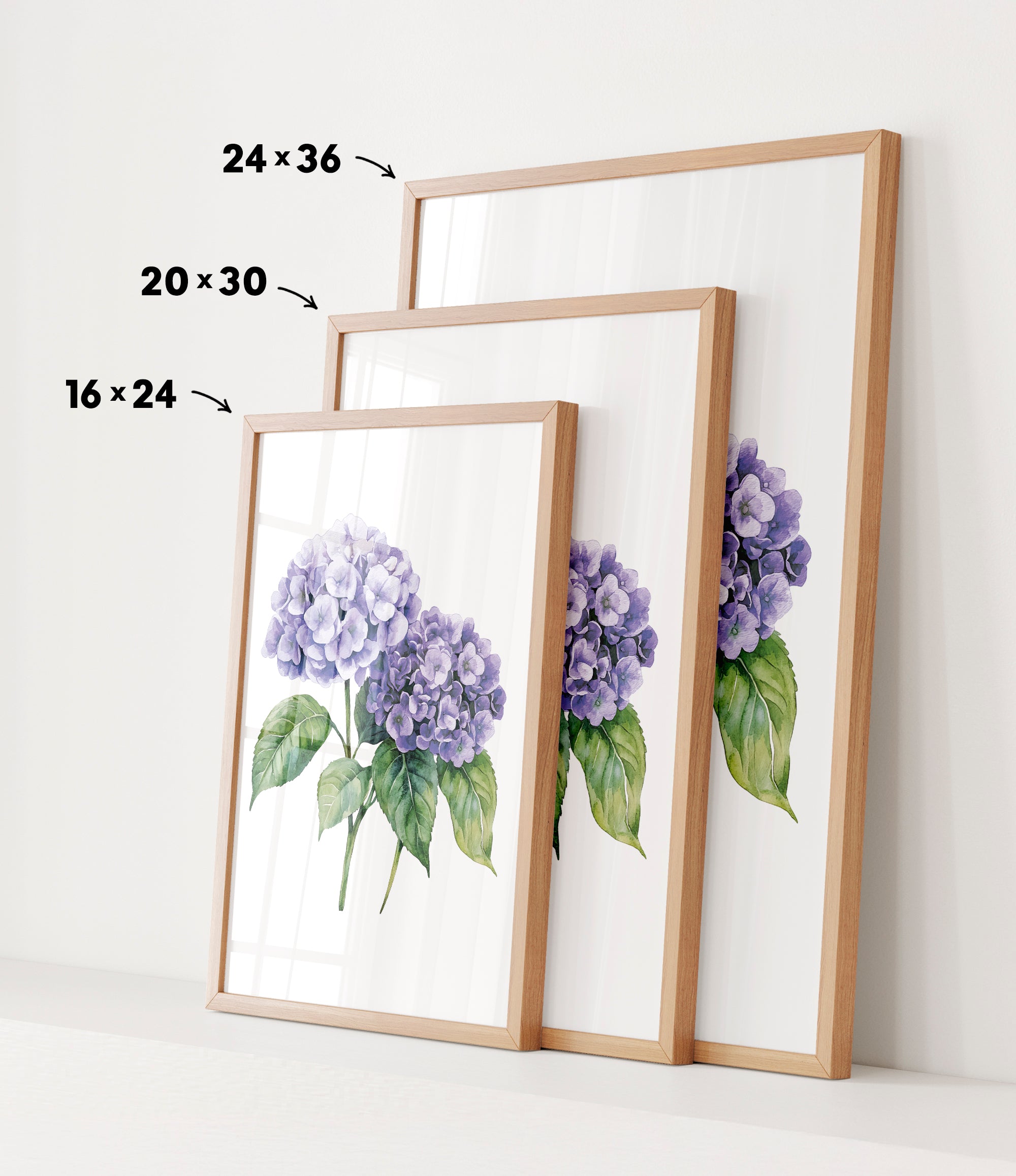 three framed prints of a watercolor painting of purple hydrangeas, each with a different size and frame.