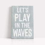 a wooden sign that says let&#39;s play in the waves