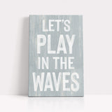 a wooden sign that says let&#39;s play in the waves