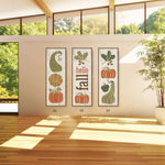 a room with a wooden floor and three posters on the wall