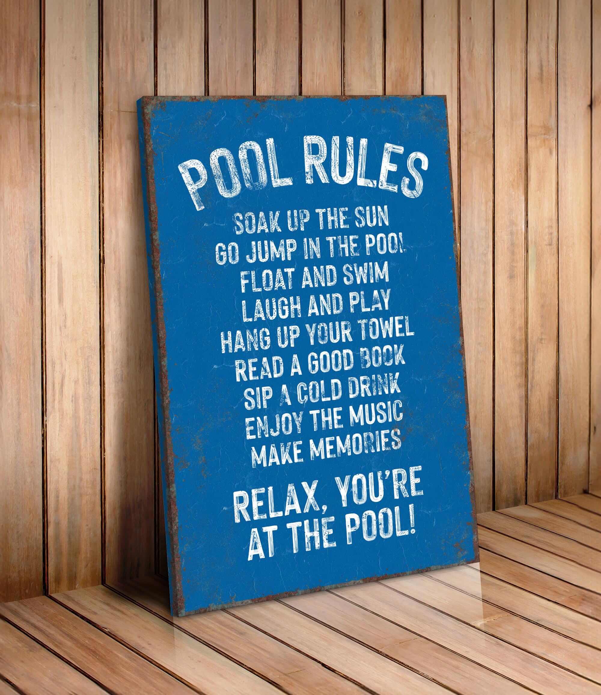a pool rules sign on a wooden floor