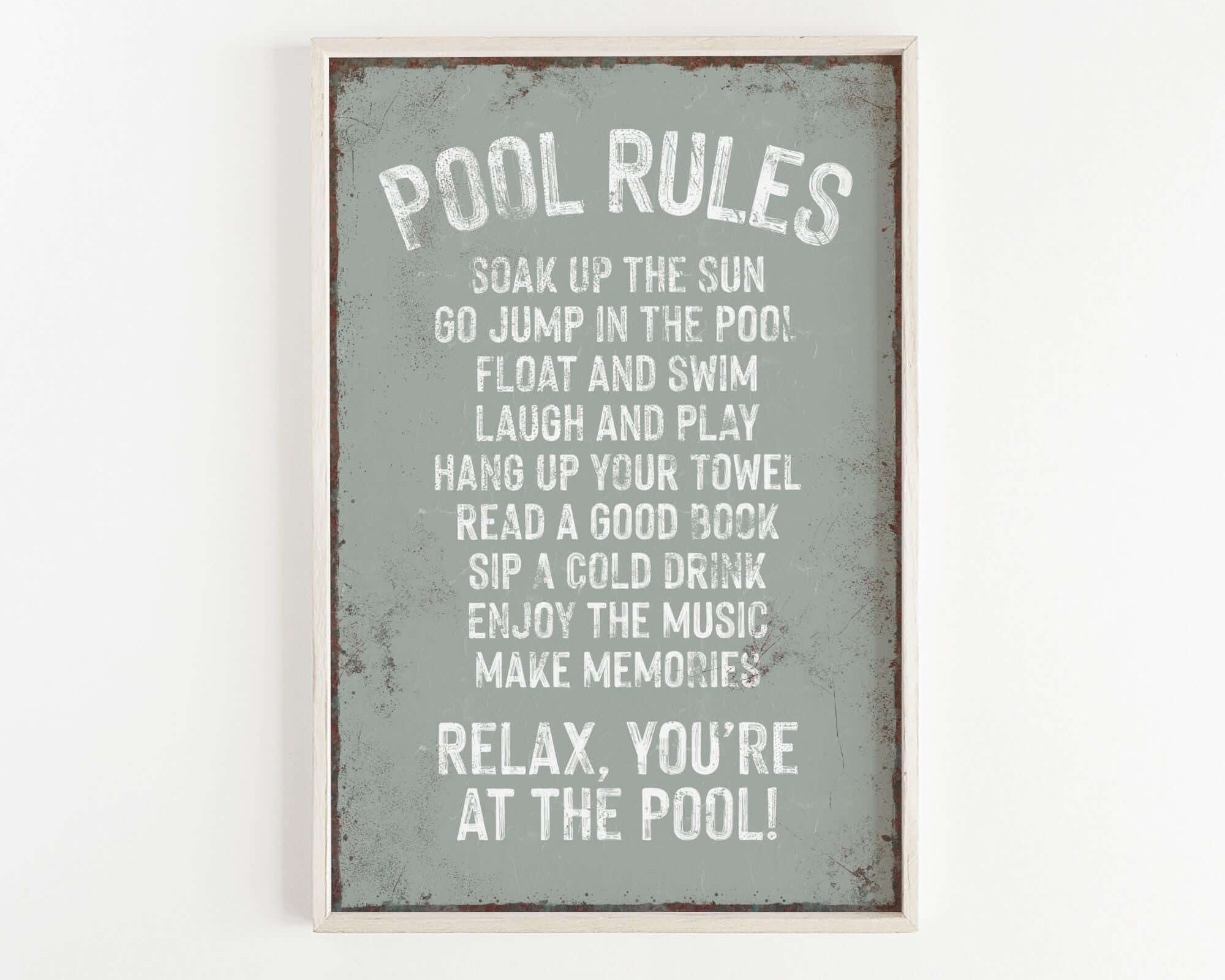 a sign that reads pool rules on a white wall