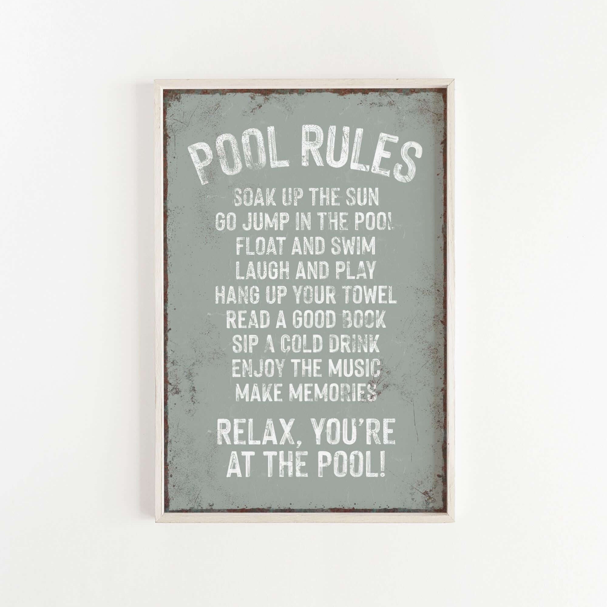 a sign that reads pool rules on a white wall