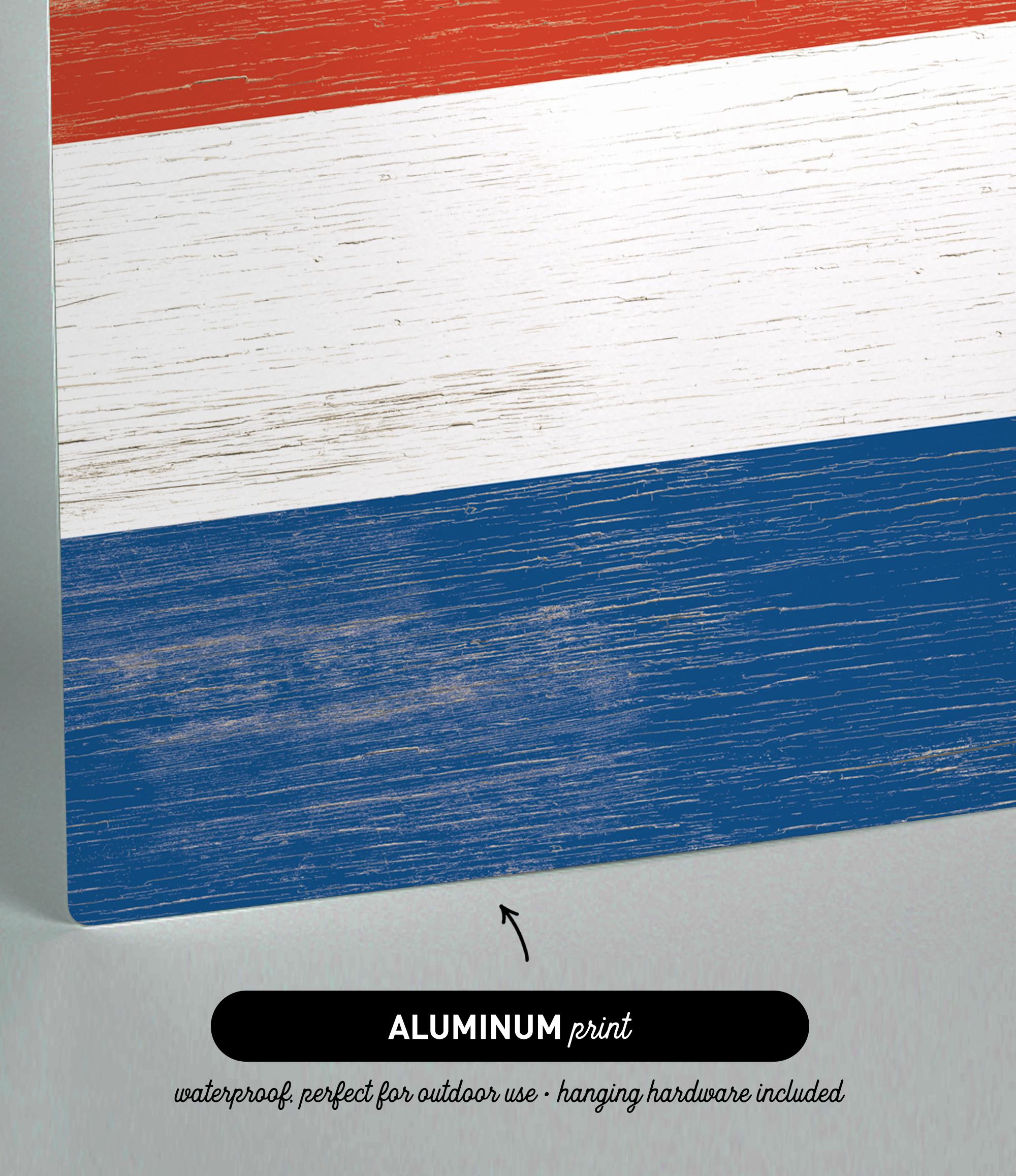 a close up of a piece of wood with a flag painted on it