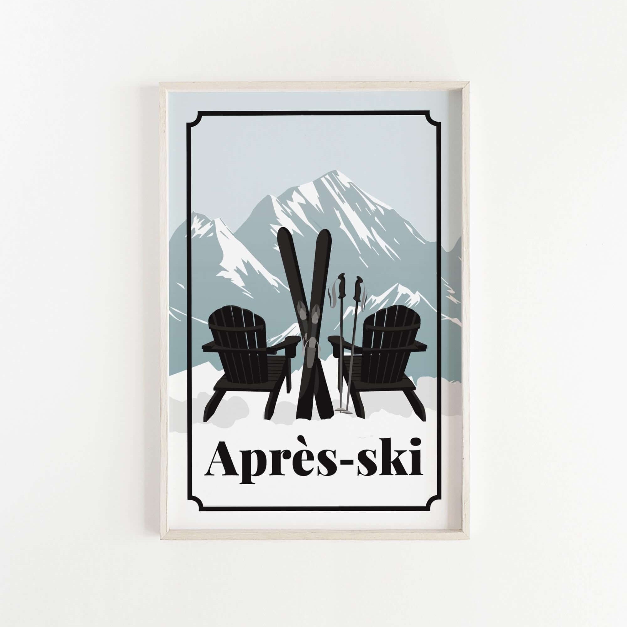 A framed print featuring a pair of black Adirondack chairs with skis crossed in front of them, set against a snowy mountain landscape.
