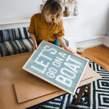 a woman holding a sign that says let&#39;s do what you want