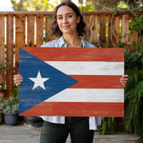 a woman holding a wooden sign with the flag of puerto