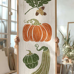 a person holding up a painting of vegetables