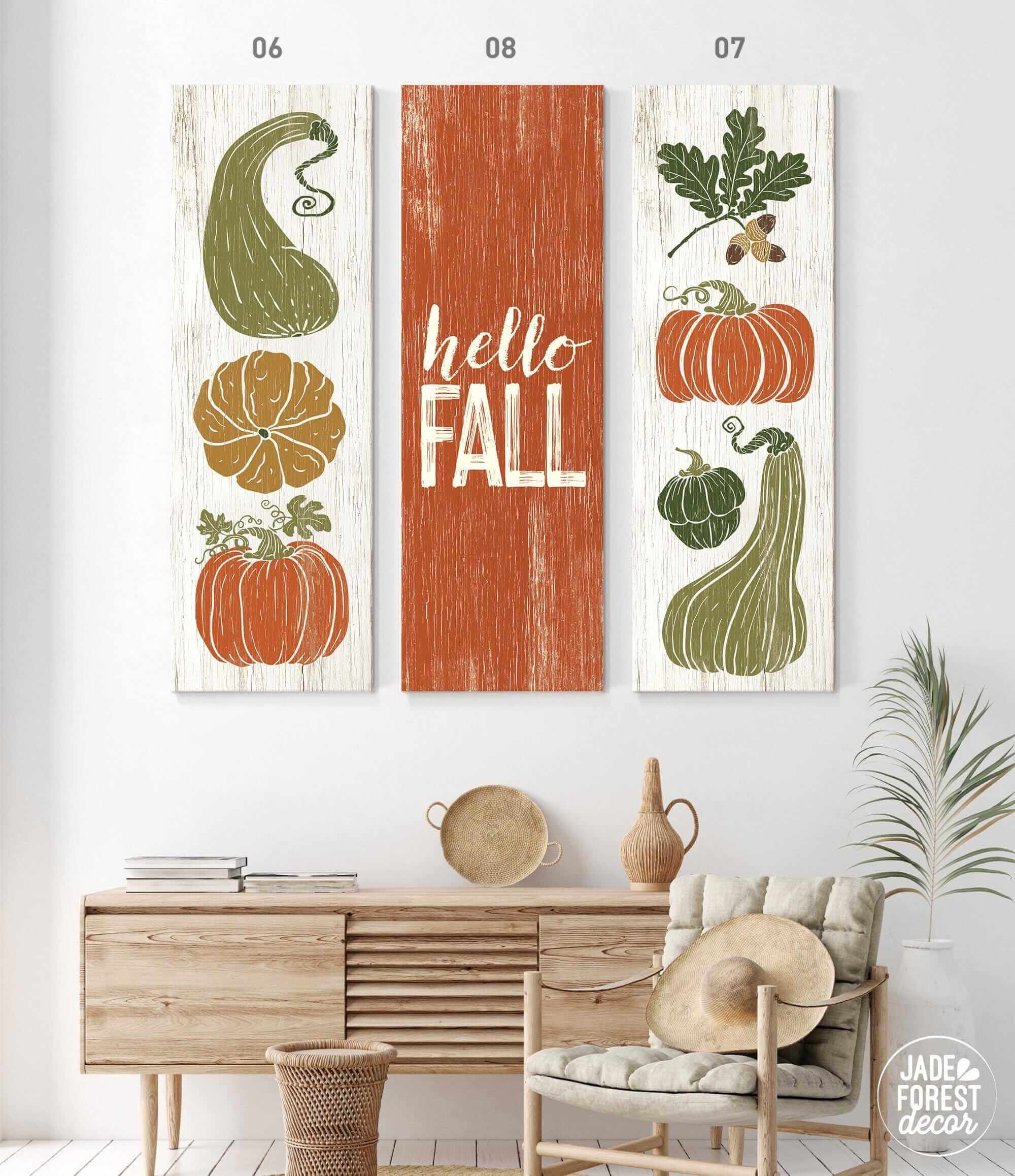 a living room with two paintings of pumpkins and gourds