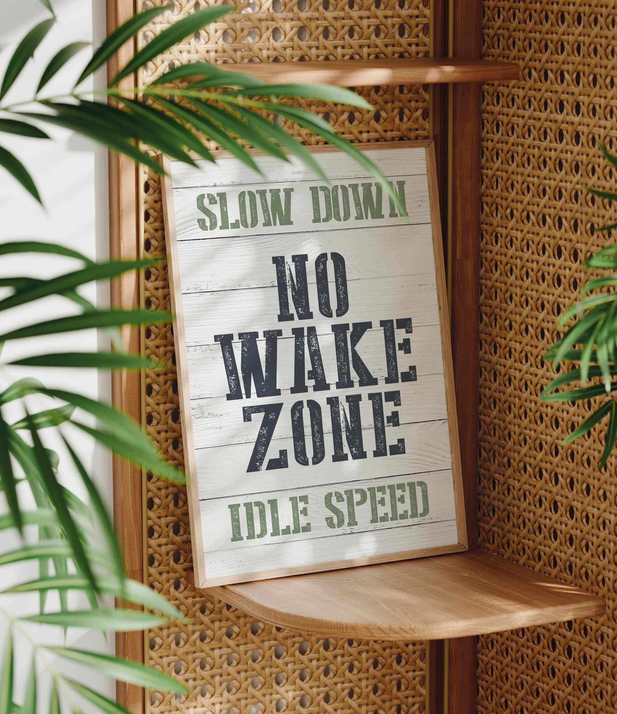 a sign that reads slow down no wake zone idle speed