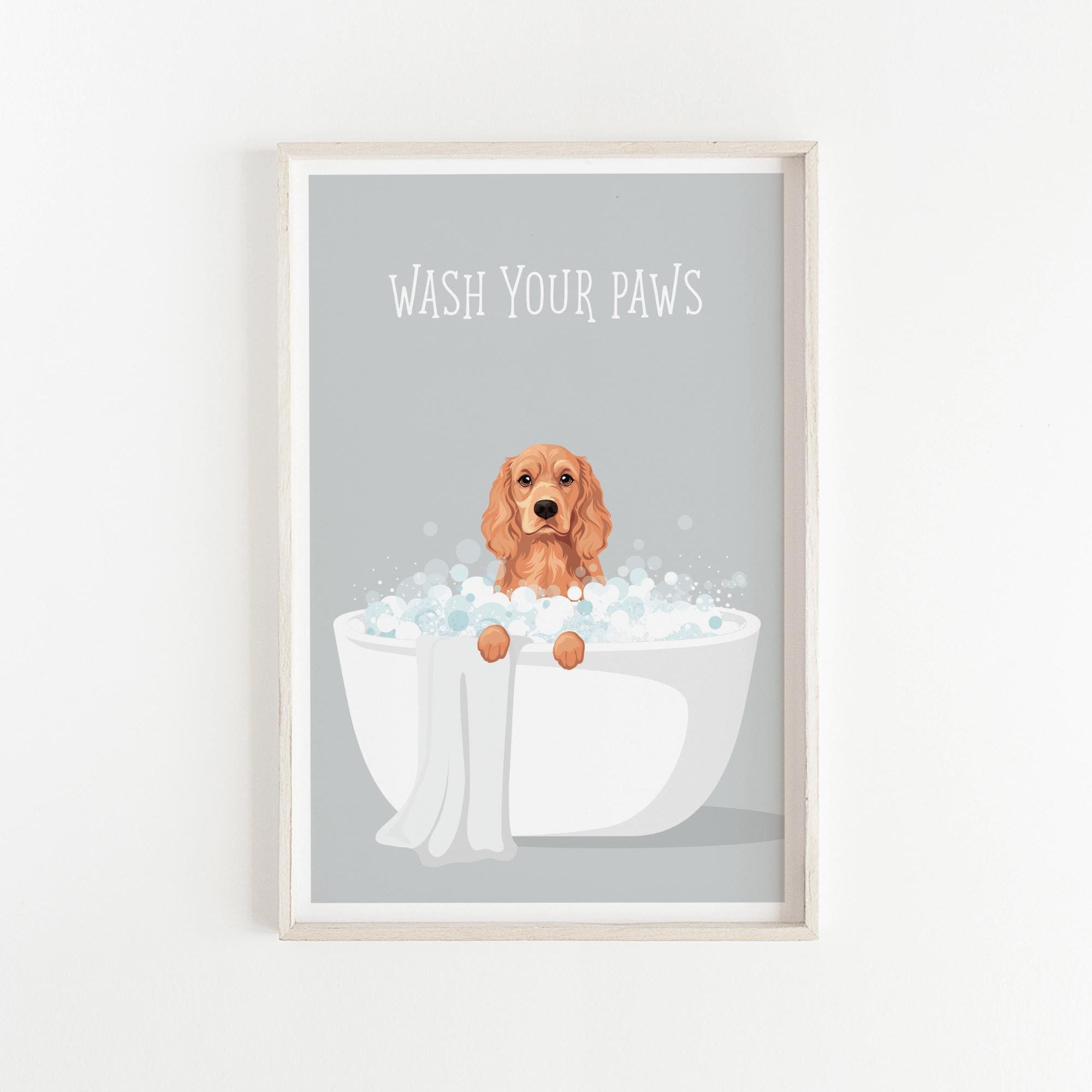 A framed illustration of a dog sitting in a bathtub filled with bubbles, with the text "WASH YOUR PAWS" displayed above it.