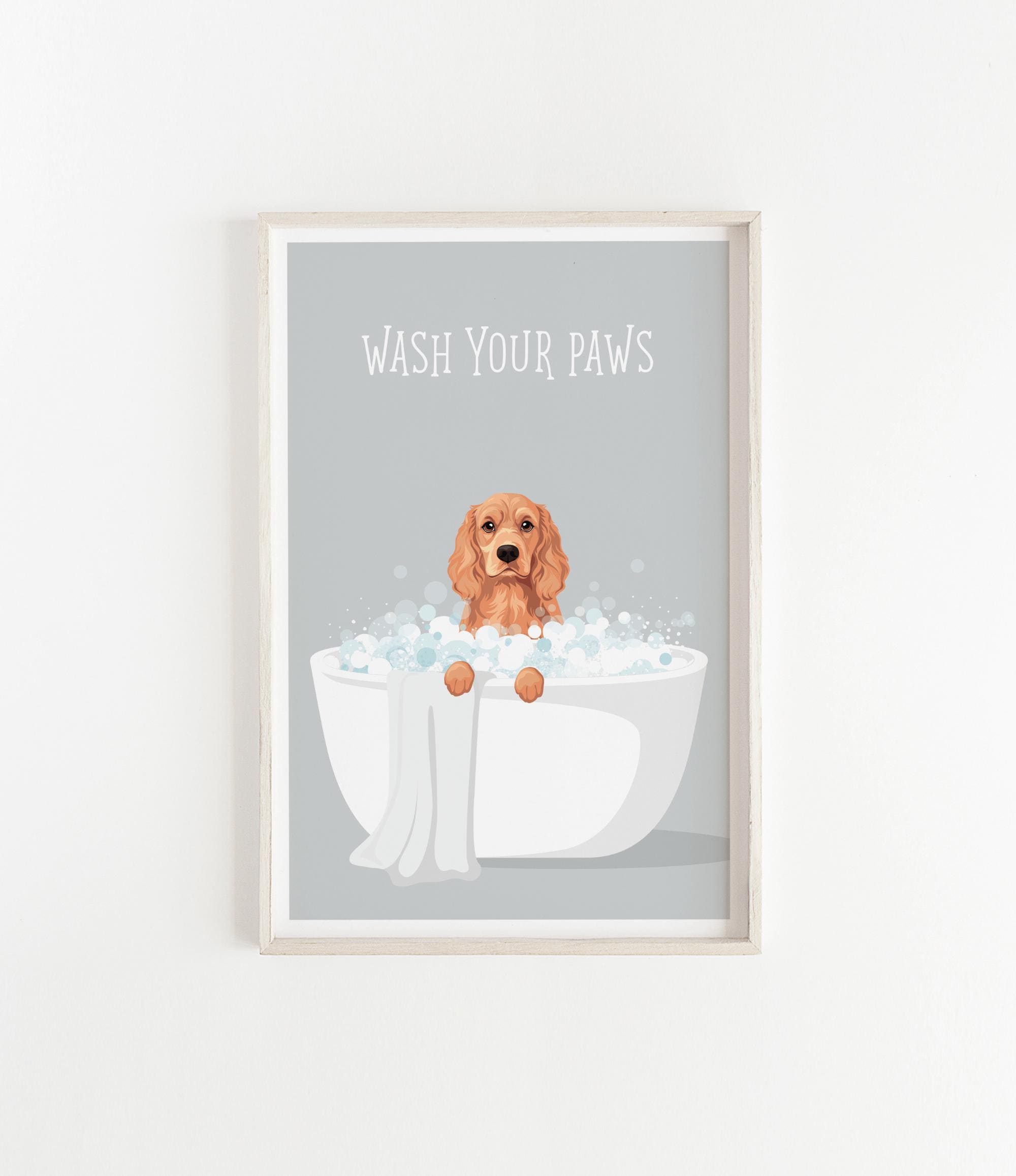 A framed illustration of a dog sitting in a bathtub filled with bubbles, with the text "WASH YOUR PAWS" displayed above it.