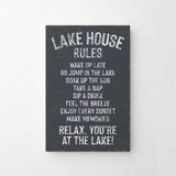 a sign on a wall that says lake house rules