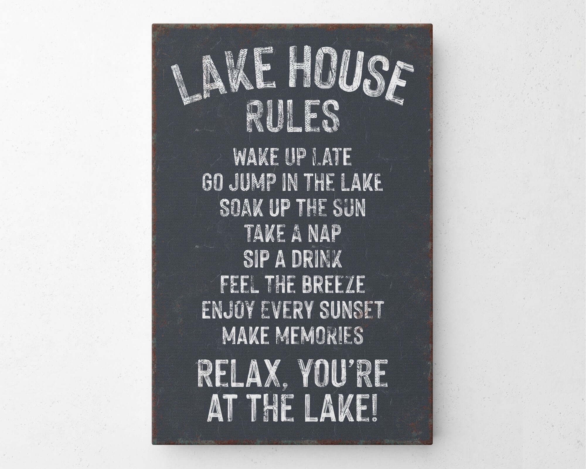 a sign on a wall that says lake house rules