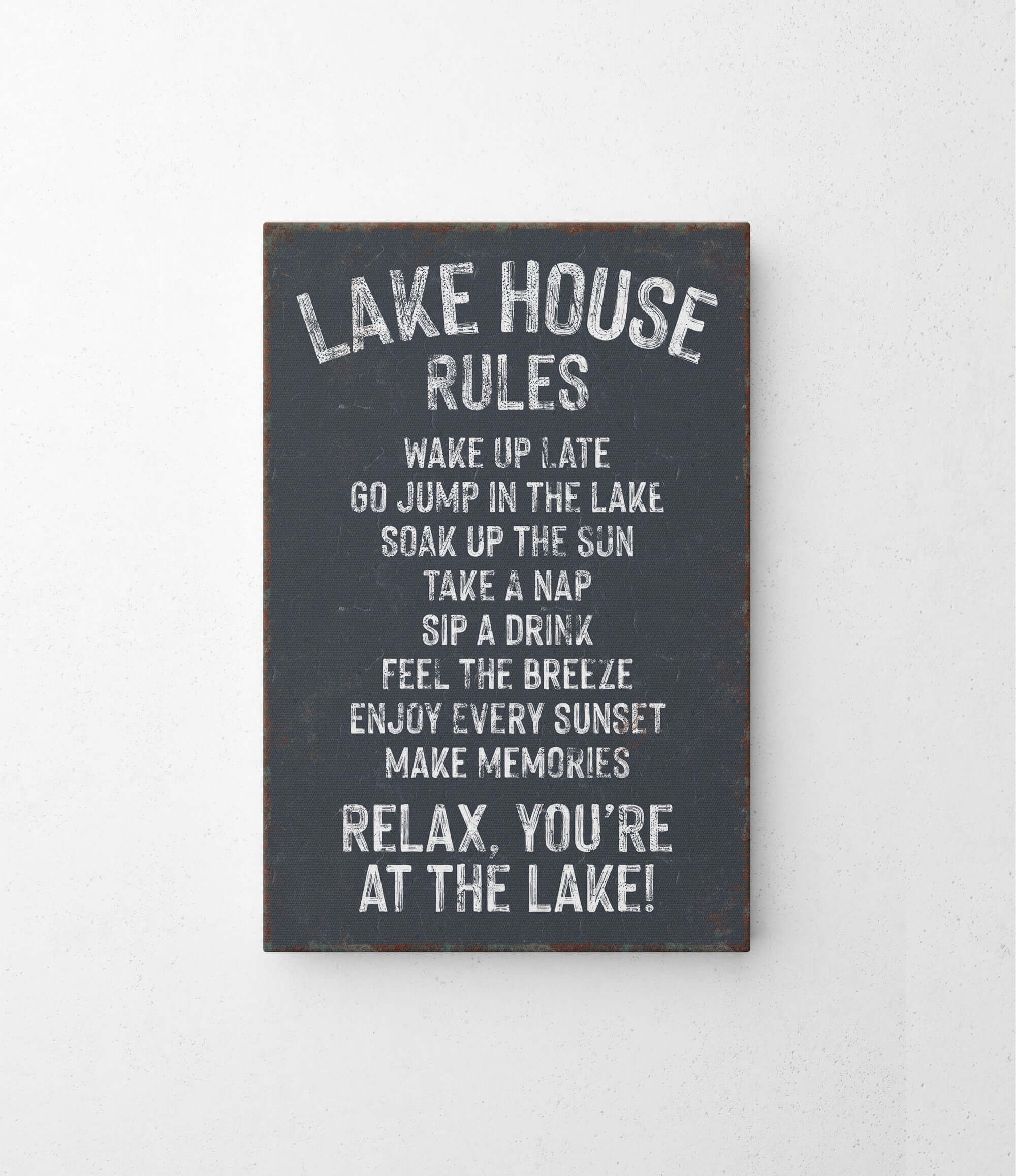 a sign on a wall that says lake house rules