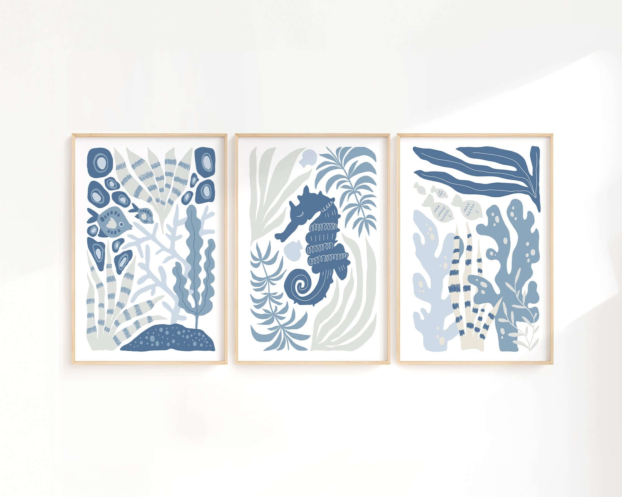 The Ocean Blocks Triptych | Set of Three Prints | 351 showcases abstract blue and white ocean-themed art, featuring seaweed and a seahorse—ideal modern wall decor.