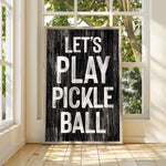 a black and white sign that says let's play pickle ball