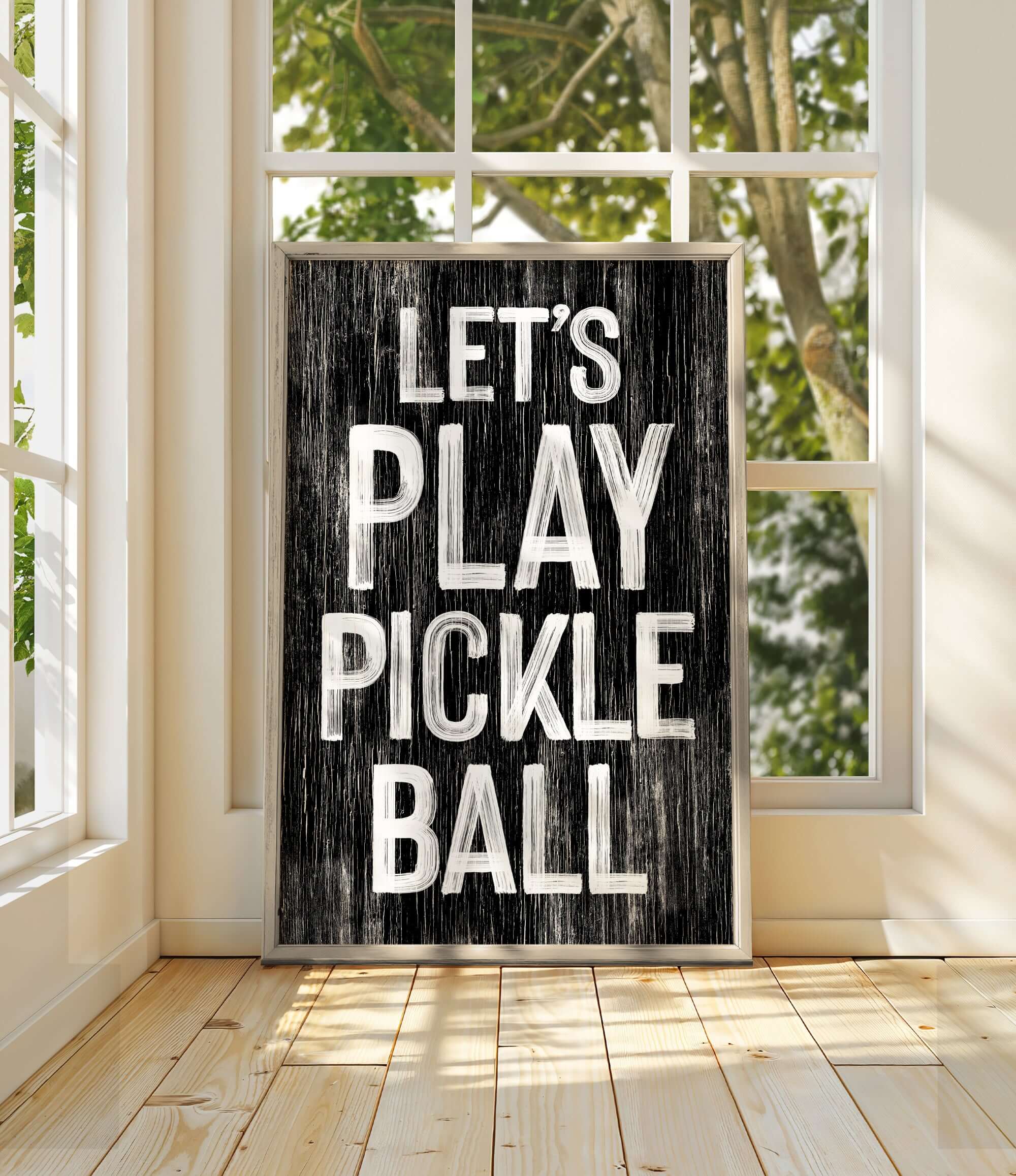 a black and white sign that says let's play pickle ball