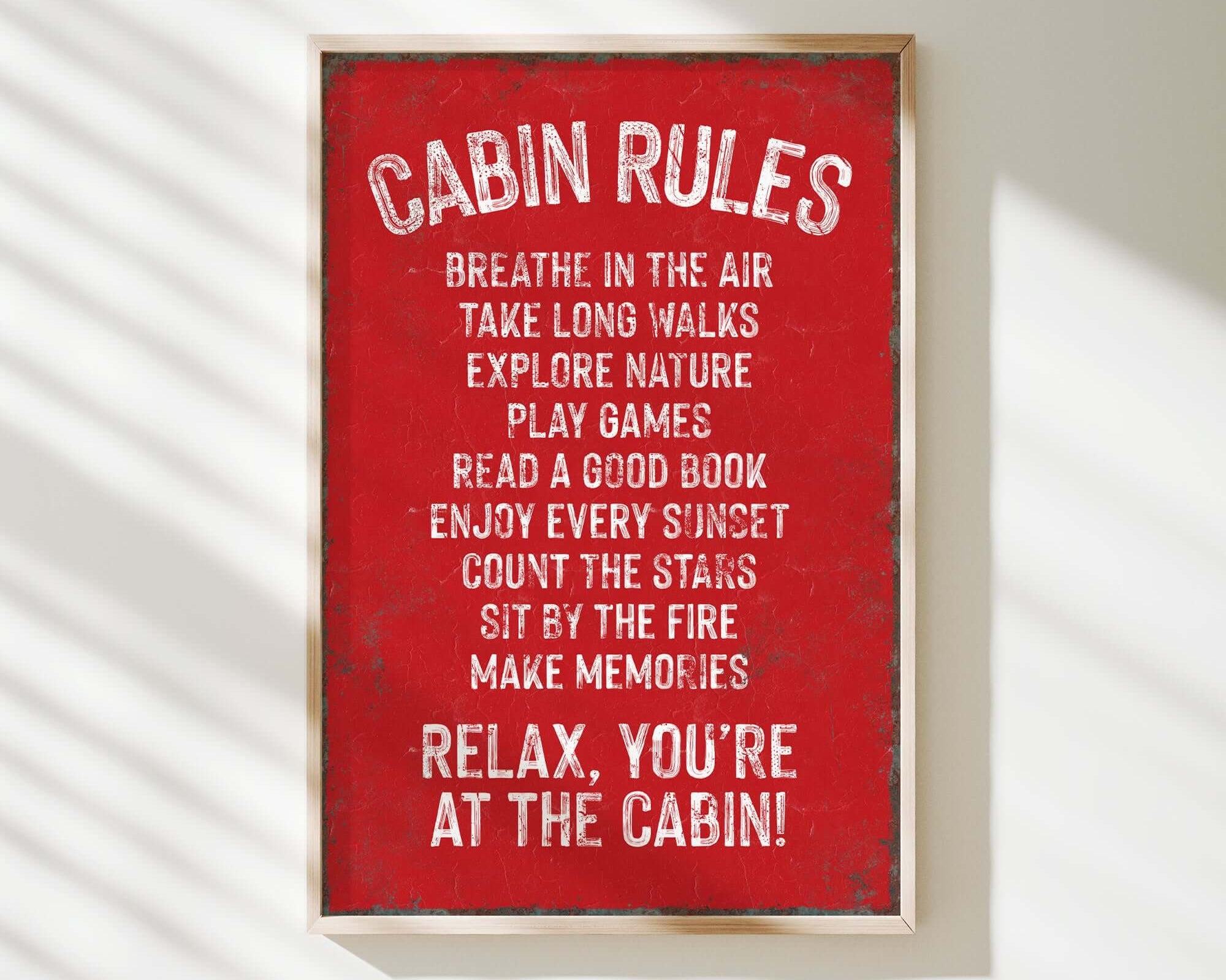 a red sign that says cabin rules hanging on a wall