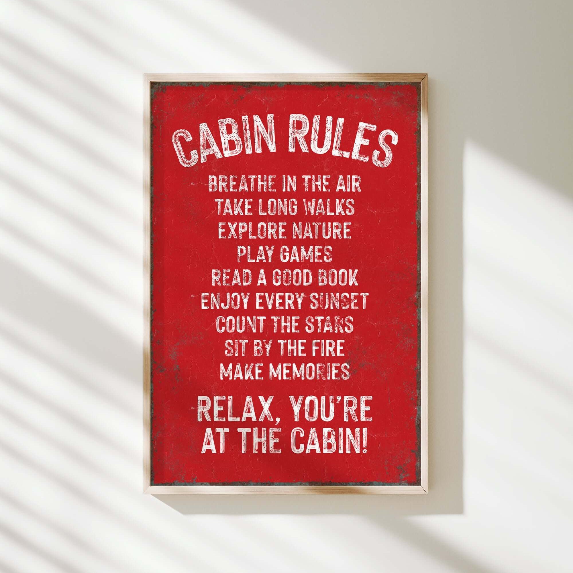 a red sign that says cabin rules hanging on a wall
