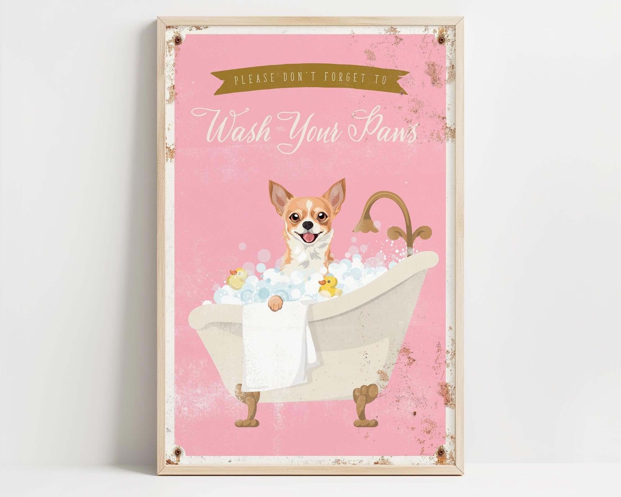 A framed poster with a cartoon image of a dog sitting in a bathtub filled with bubbles, accompanied by the text "Please don't forget to wash your paws".