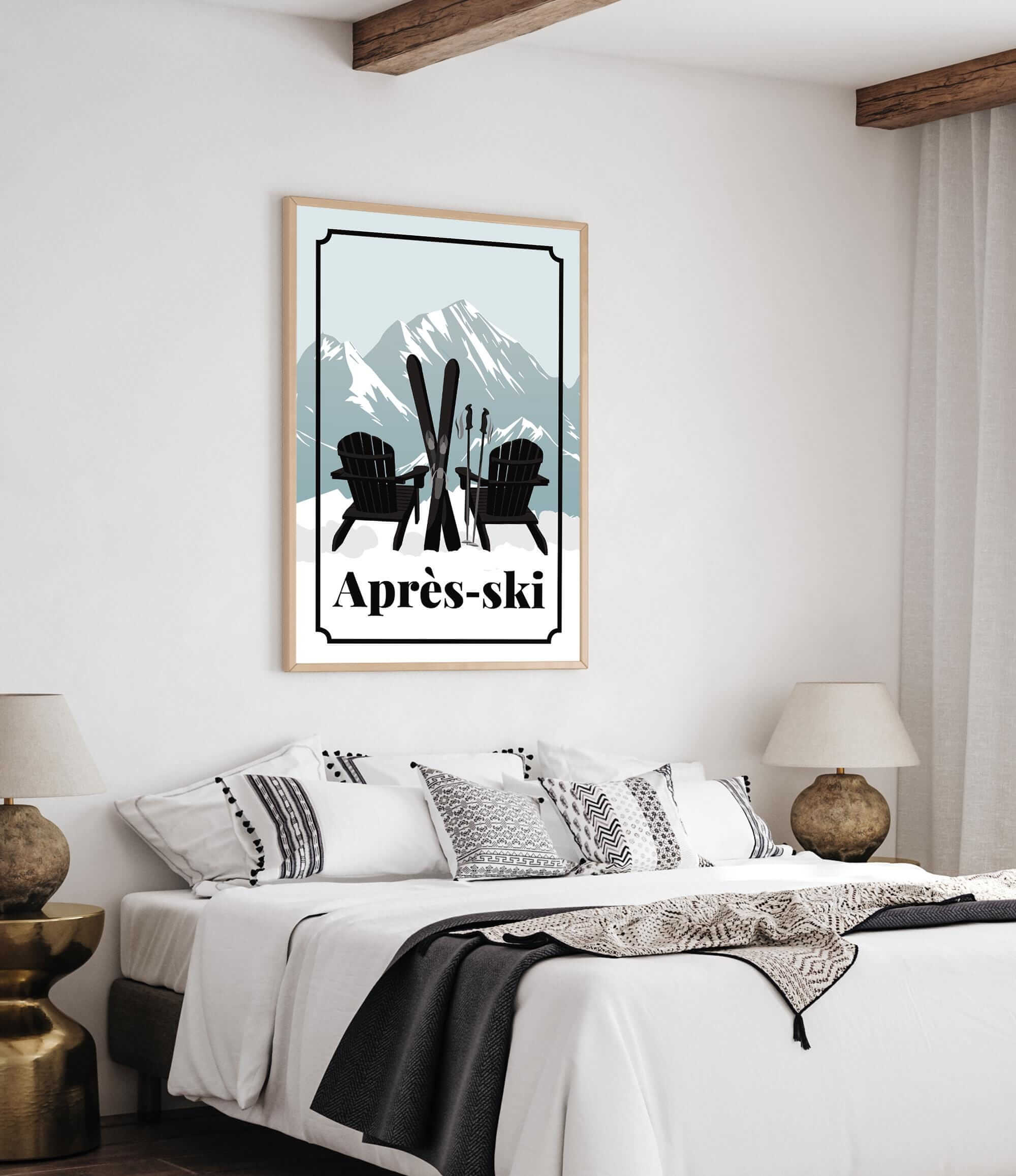 a bedroom with a bed, two lamps, and a framed poster of a mountain landscape with ski equipment.