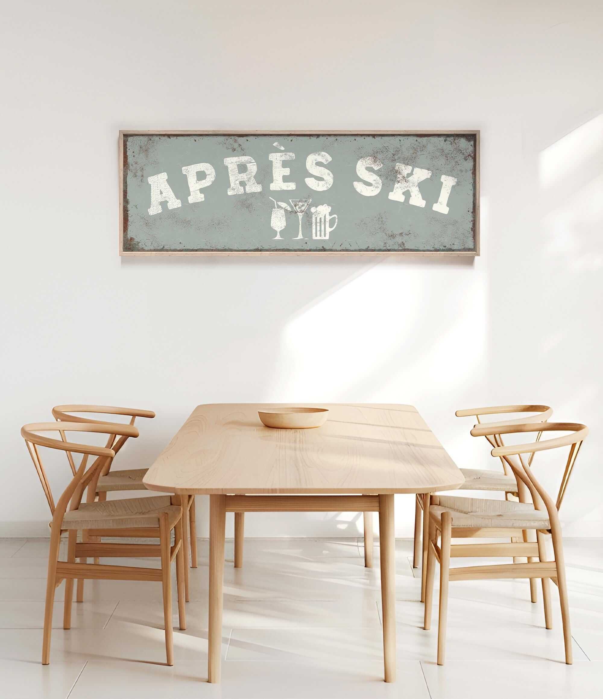 a dining room with a wooden table and four chairs. Above the table, there is a framed sign that says "APRESS SKI".