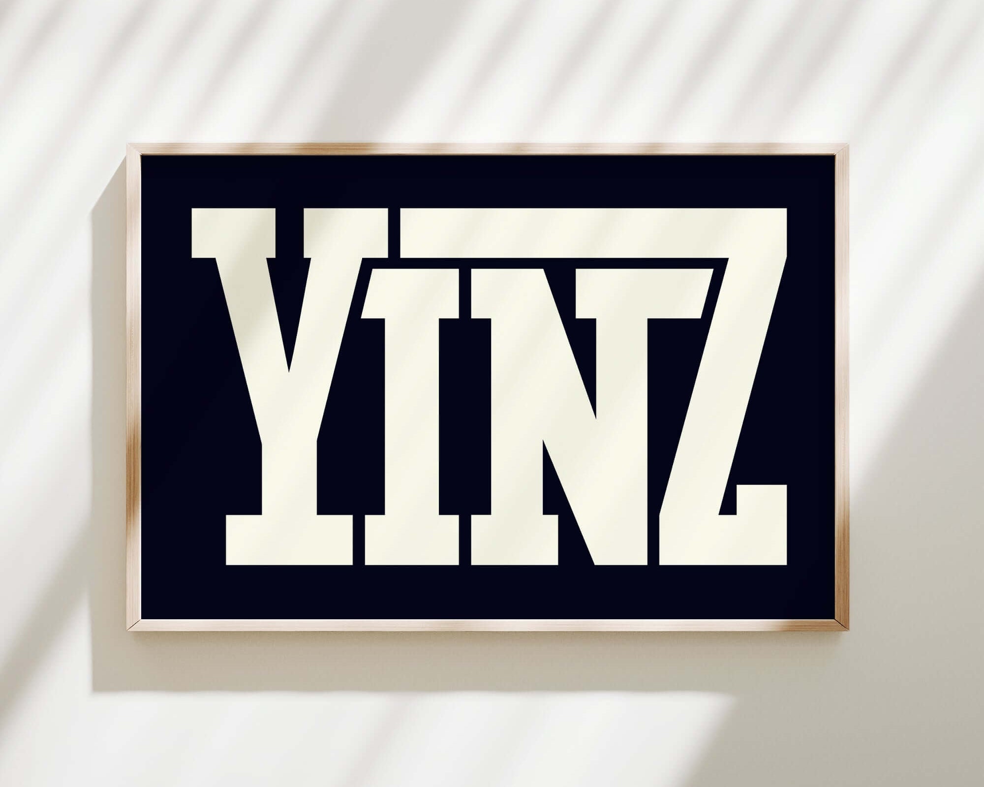 The Yinz Sign Print, Black features bold white letters on a black background and brings modern farmhouse charm to your home decor.