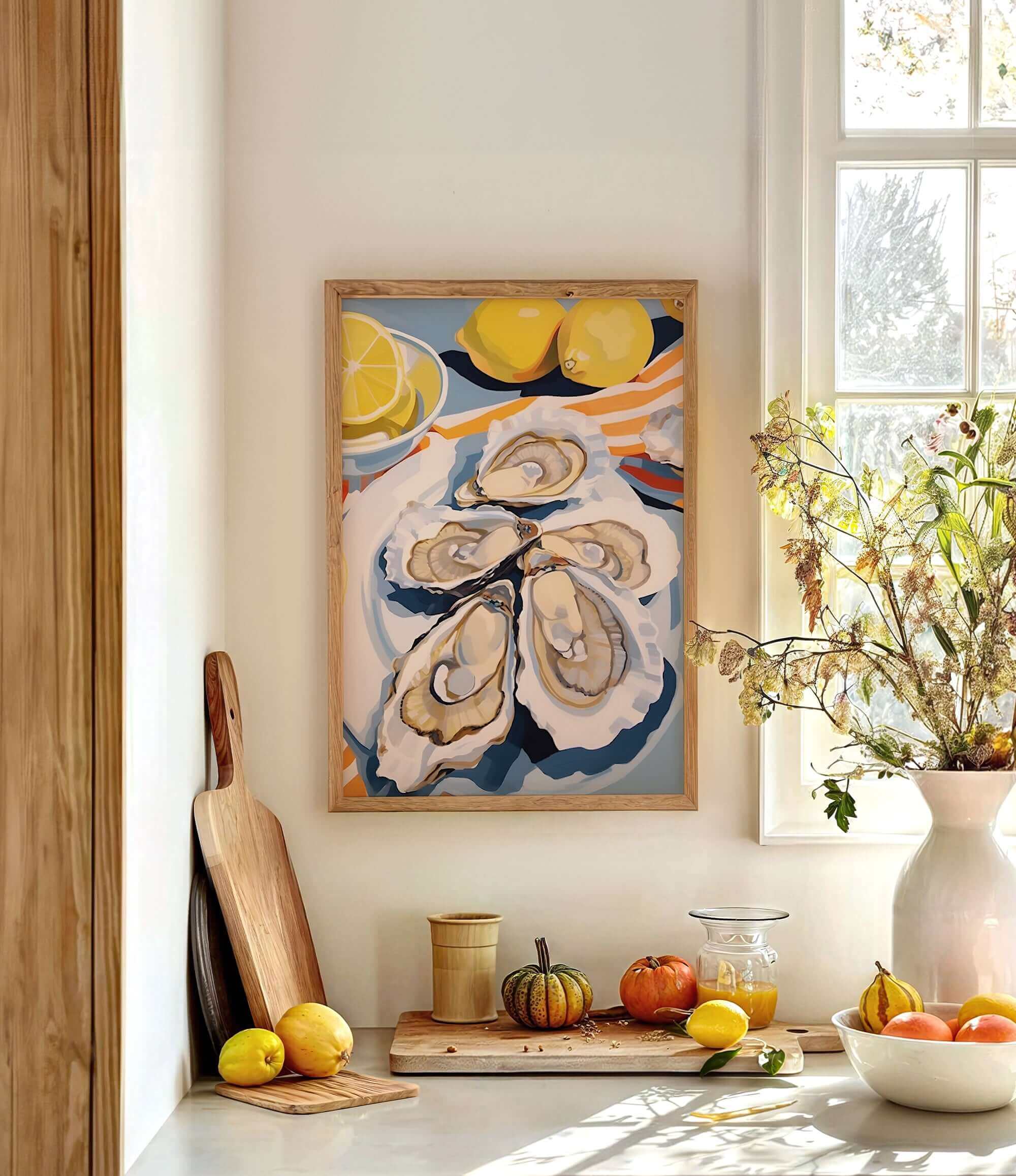 a kitchen counter with a framed painting of oysters, a vase of flowers, and various fruits and vegetables.