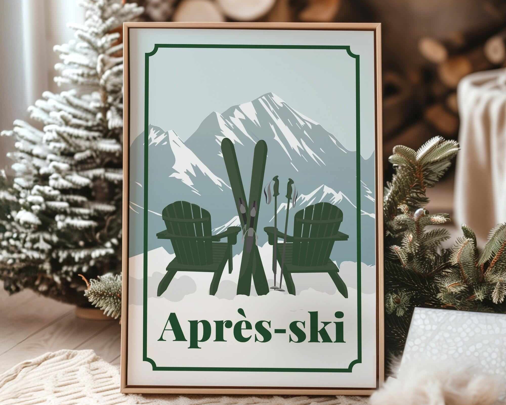 A framed print with a winter scene featuring two green Adirondack chairs and skis, set against a snowy mountain backdrop.
