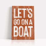 a wooden sign that says let&#39;s go on a boat