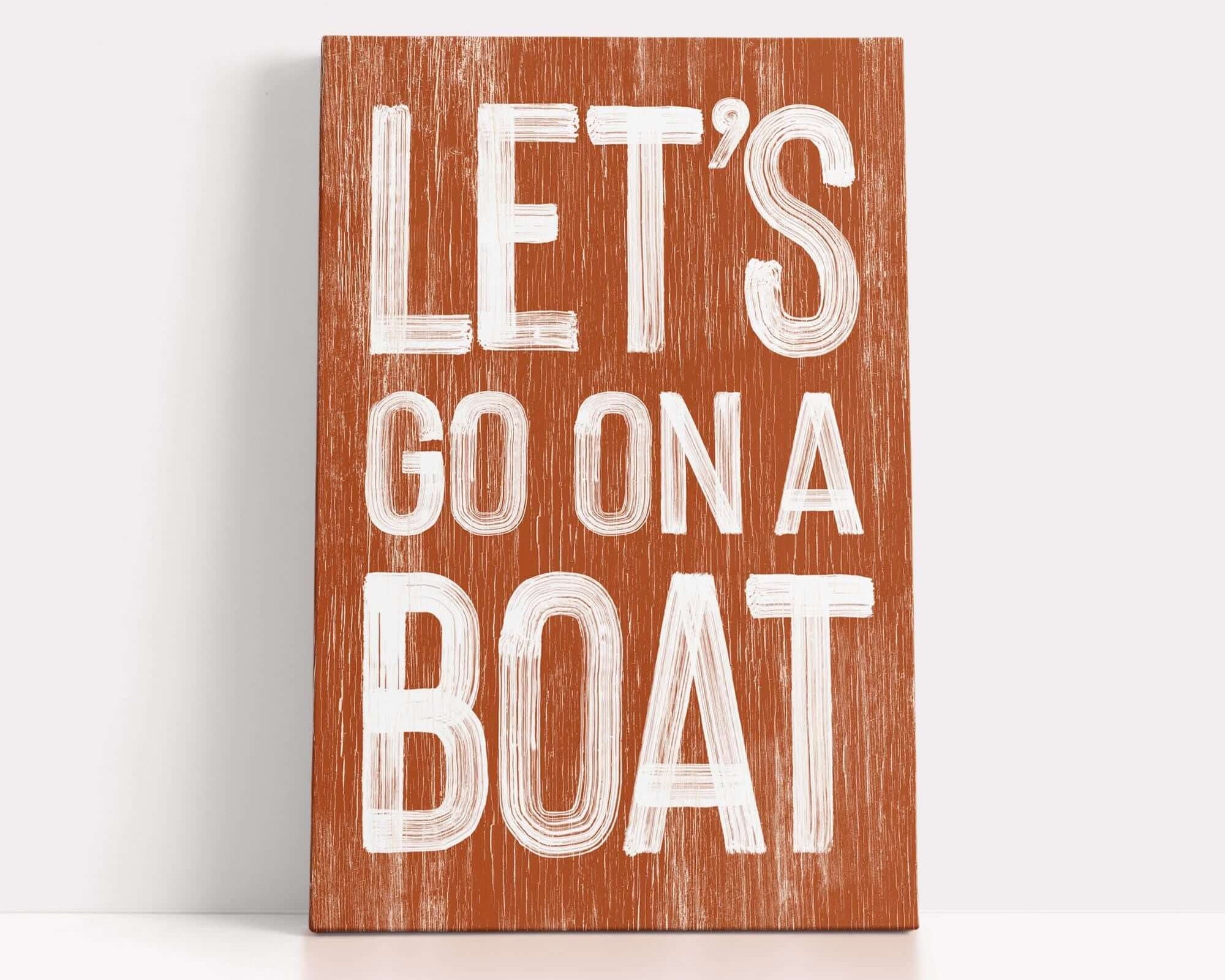 a wooden sign that says let's go on a boat