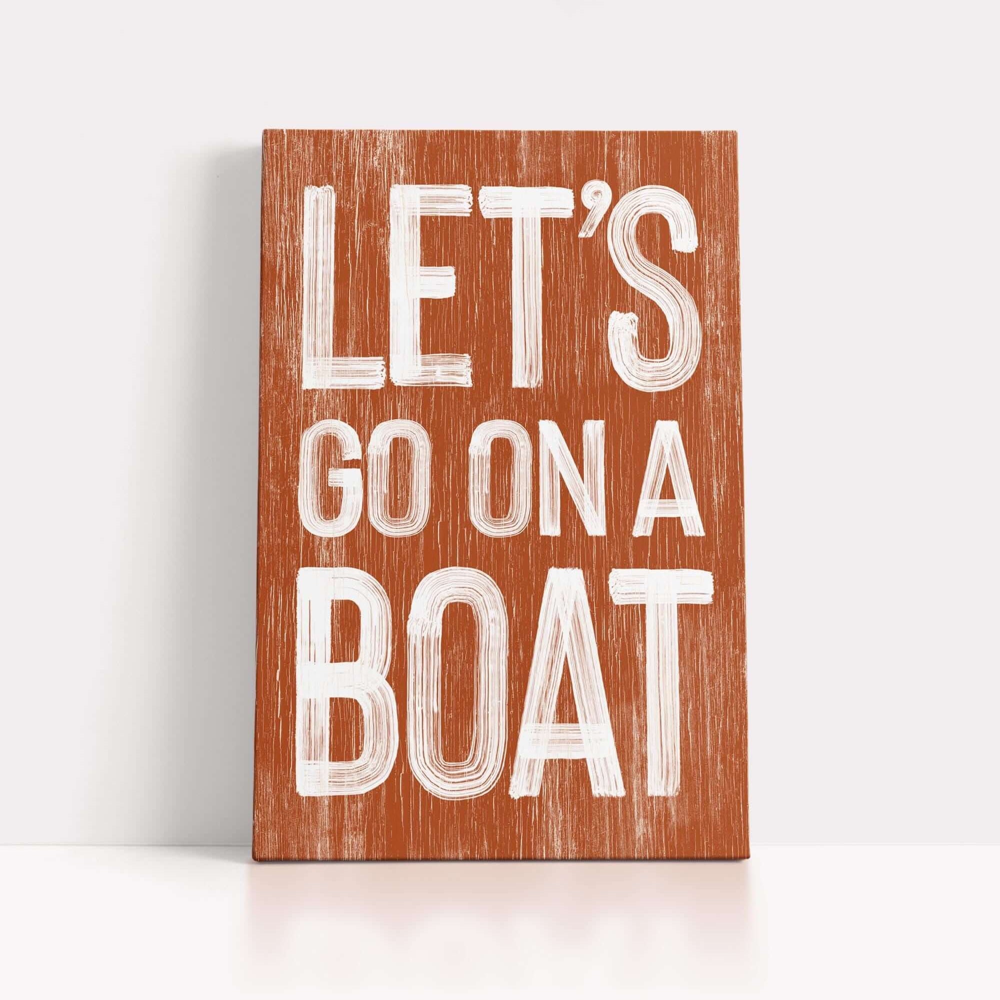 a wooden sign that says let's go on a boat